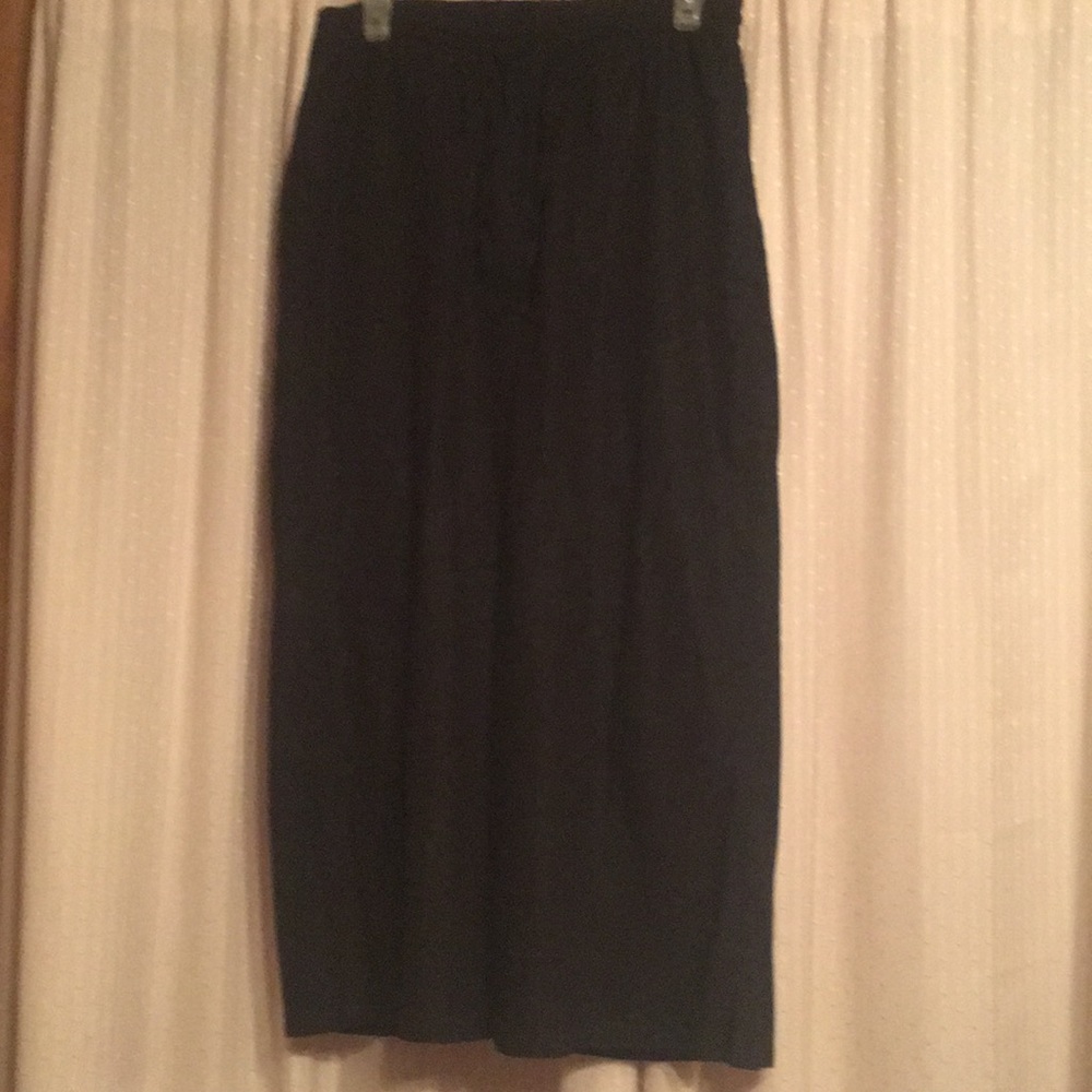 Women within ankle length wide leg pants.